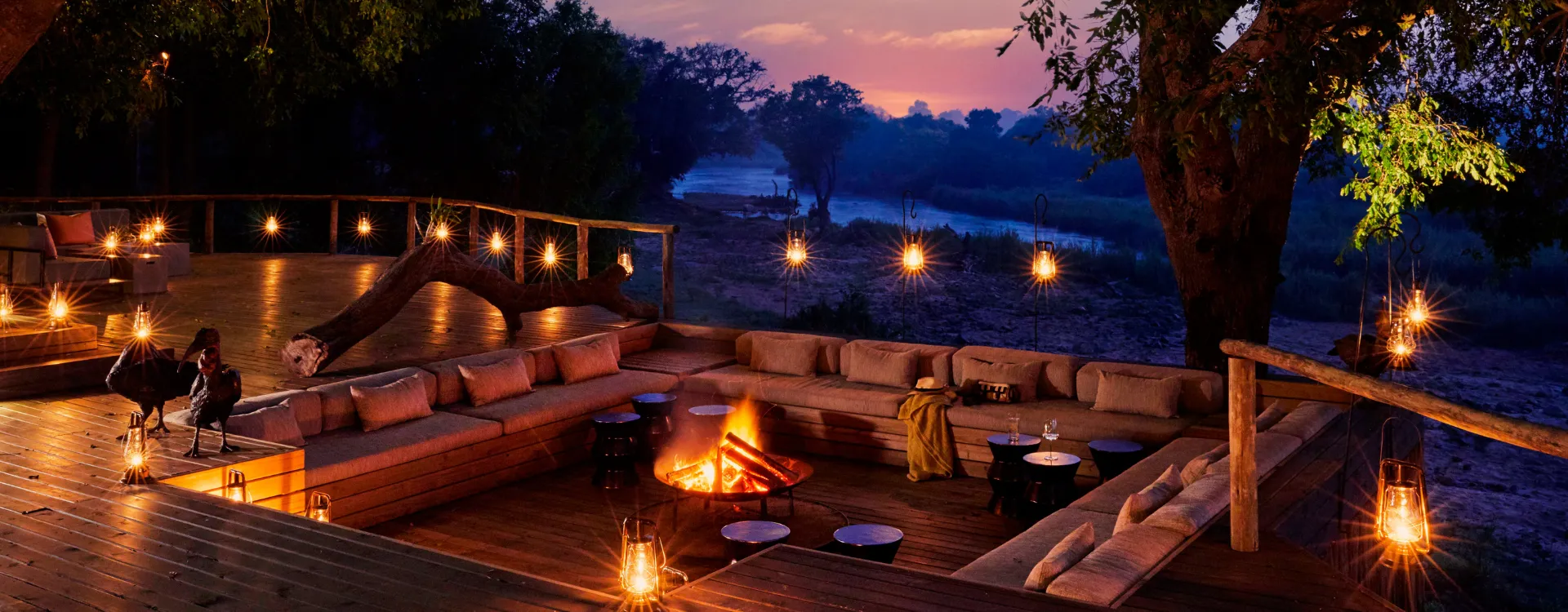 Fire pit overlooking the river at Lion Sands Ivory Lodge