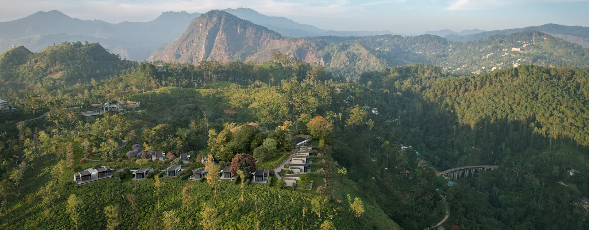 Panoramic views at Uga Ghiri of the surrounding tea plantations and the famous Nine Arch Bridge